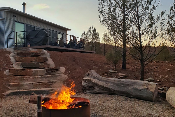 Fire pit with cabin at Willow Springs Station